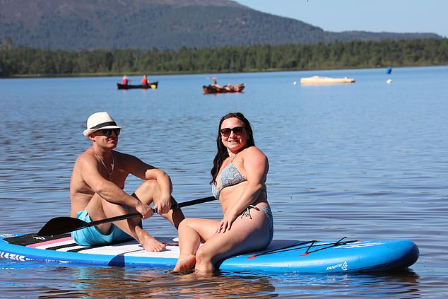 SCOTLAND: Beata and Igor Gazdzik paddleboarding at Loch Morlich beach, near Aviemore on July 12, 2025