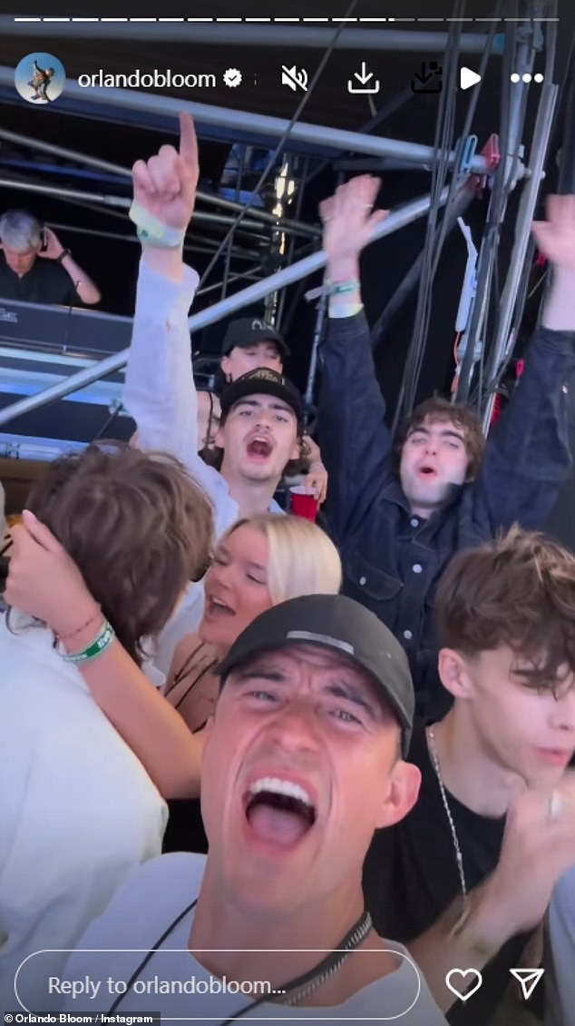 The English actor, 48, enjoyed watching brothers Liam and Noel from the VIP area along with their children and famous pals; pictured with Gene Gallagher