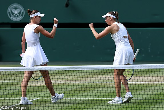 LONDON, ENGLAND - JULY 13: Veronika Kudermetova celebrates with Elise Mertens of Belgium against Su-Wei Hsieh of Chinese Taipei and Jelena Ostapenko of Latvia during the Ladies Doubles Final on day fourteen of The Championships Wimbledon 2025 at All England Lawn Tennis and Croquet Club on July 13, 2025 in London, England. (Photo by Clive Brunskill/Getty Images)