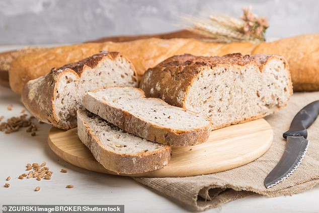 Bread is full of nutrients like fibre, natural sugars, proteins, B vitamins such as thiamin, niacin and folate, as well as minerals like iron and zinc - but its high concentration of carbohydrates can sometimes leave you feeling hungry after eating a slice or two (Stock Image)