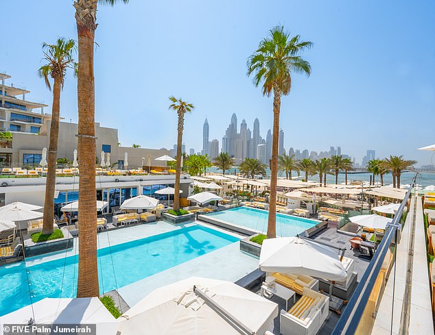 Another reason couple's could be ditching secluded beaches and peaceful getaways is post-pandemic FOMO [fear of missing out] (pictured: Pool at FIVE Palm Jumeirah)
