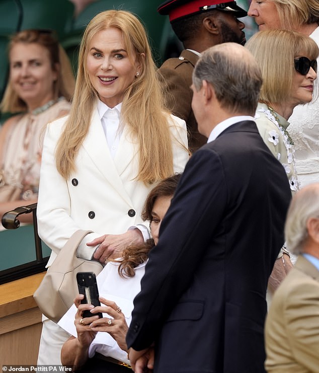 Nicole, 58, exuded sophistication in a cream double-breasted blazer layered over a smart collared shirt, as she took her seat in the Royal Box