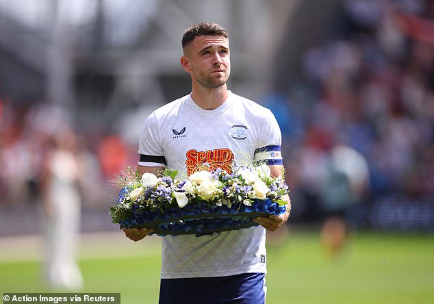 Preston captain Ben Whiteman placed a wreath in front of Liverpool fans ahead of the match