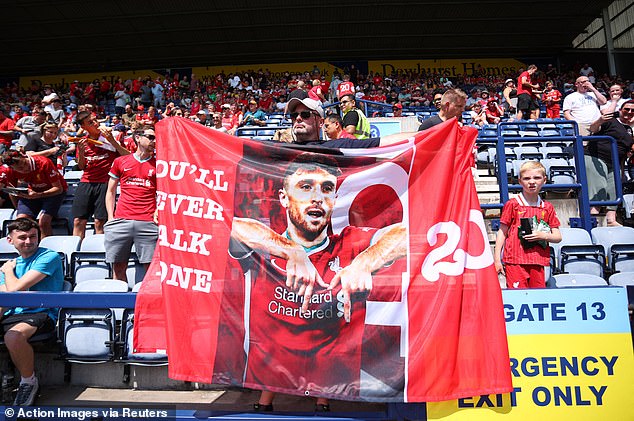 Another supporter displayed a flag featuring Jota celebrating a goal for Liverpool