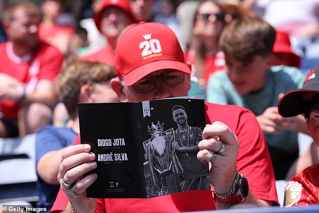 One supporter was seen reading the 16-page programme produced by Preston for the match