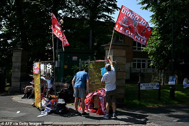 Flags paying tribute to Jota are seen on display prior to the game between Liverpool and Preston