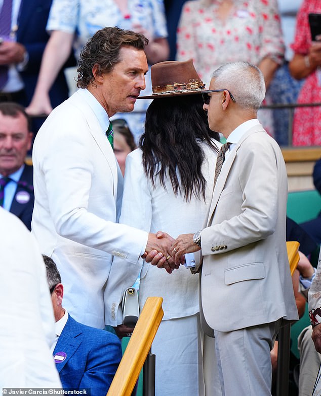 Hollywood actor Matthew McConaughey, pictured shaking the hand of Sir Sadiq Khan, donned a white jacket and green tie as he sat in the royal box