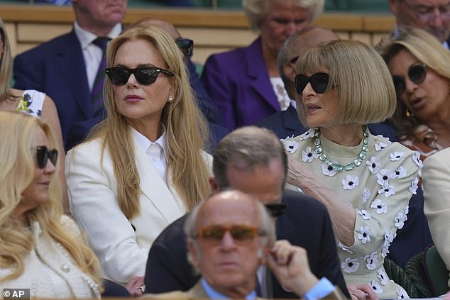 Meanwhile, Nicole opted for a cream double-breasted blazer layered over a smart collared shirt despite the heat