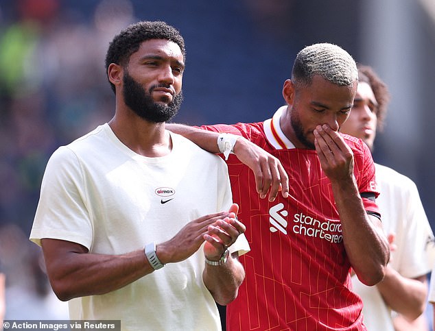 Joe Gomez and Gakpo look emotional at the full time whistle following the game at Deepdale