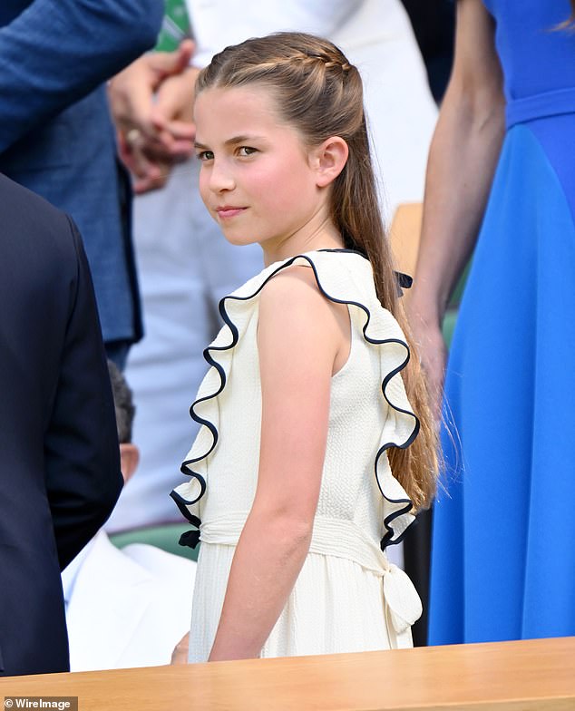 Princess Charlotte watches on at the court as she joins her mother, father and brother George to enjoy the sport