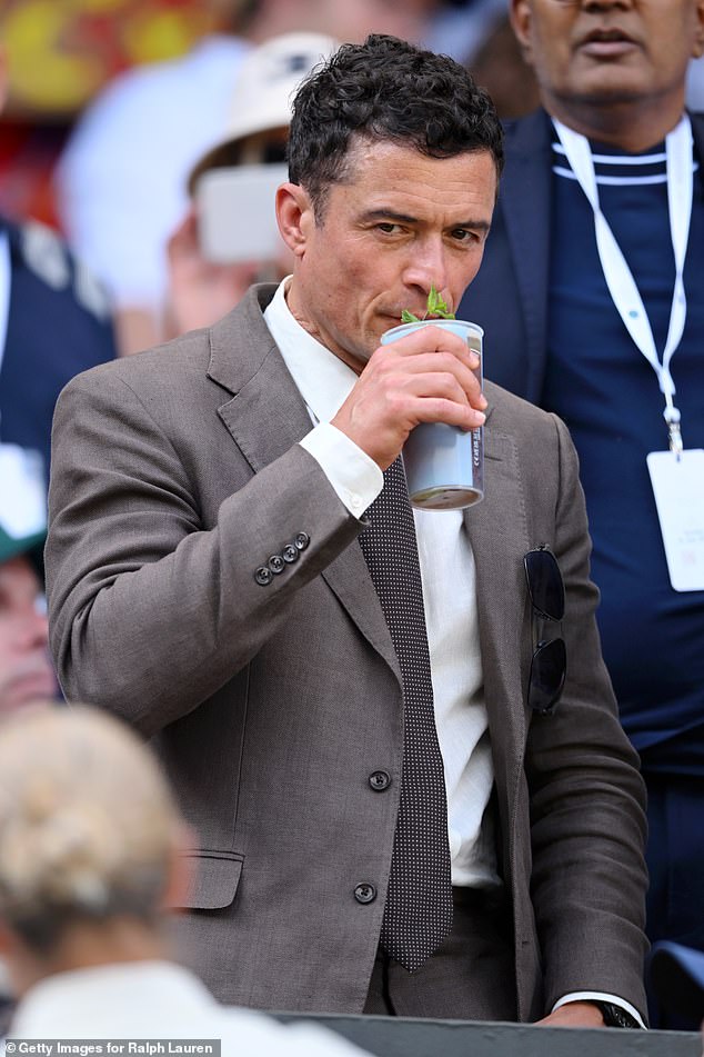 Orlando Bloom, wearing Ralph Lauren, attends day fourteen of the Wimbledon Tennis Championships