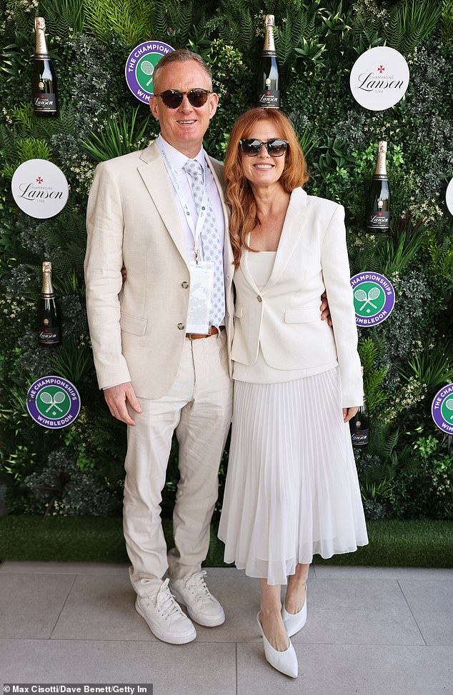 She was glowing as she posed beside the man, who warmly rested his arm around her waist as the pair beamed for photos against the media wall