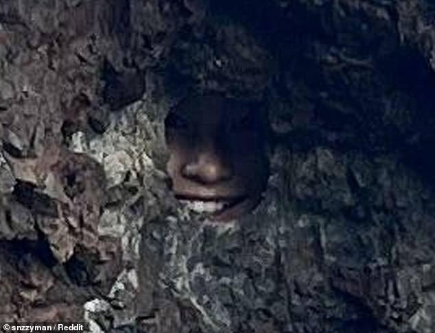 The daughter's smile sticking out from the rocks gave people a bit of a scare