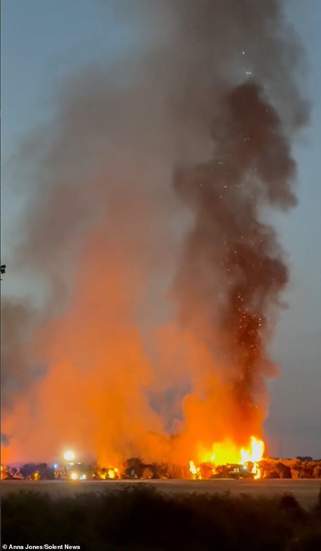 The dramatic fire caused thick black smoke to pour into the sky, throwing up soot and debris