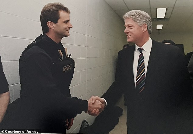 The woman, named Ashley, 36, from Washington, D.C., explained exclusively to the Daily Mail that her father spent 25 years protecting political figures. He's seen with President Bill Clinton