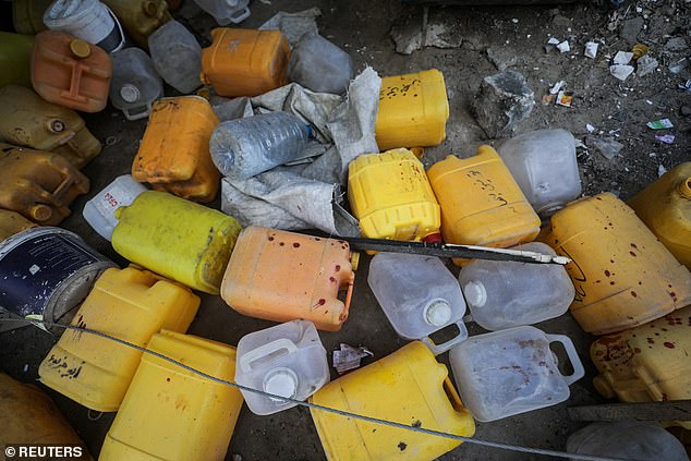 Blood stains are seen at the site of an Israeli strike that killed Palestinians collecting water