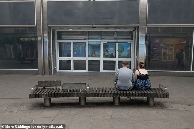 Two shoppers take a seat in Swindon town centre