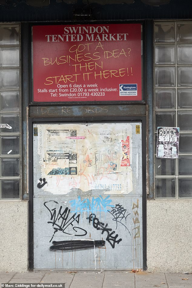 A sign on the market says 'Got a business idea? Then start it here?' but the market has long been shuttered