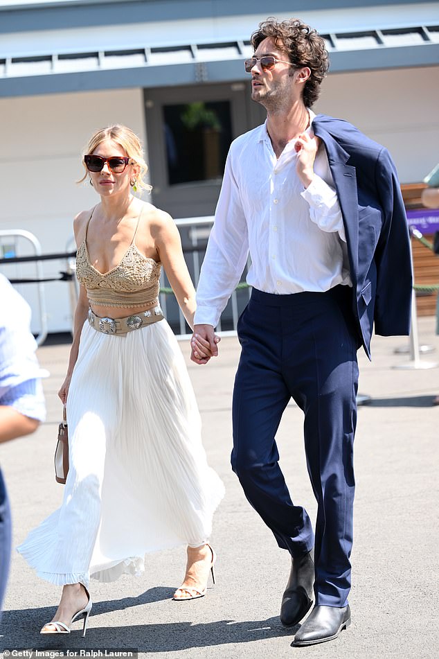 The actress, 43, looked utterly loved-up as she arrived hand-in-hand with boyfriend Oli Green, 28, ahead of the hotly-anticipated men's singles final