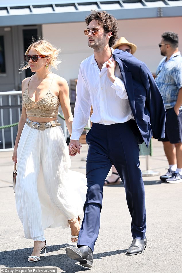 However, the Bridget Jones: Mad About the Boy star was unable to resist whipping off his jacket soon after arriving, to sling it over his shoulder amid the sweltering temperatures