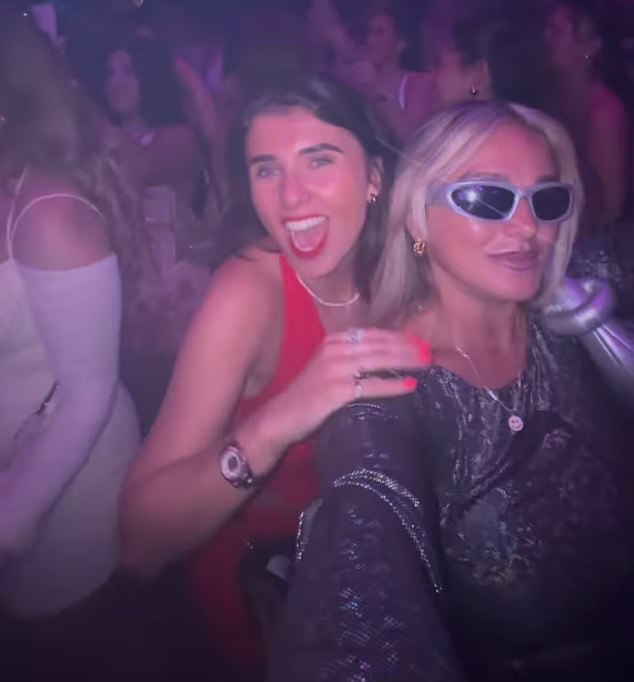 Hettie and her fellow partygoer at a nightclub during their 24-hour trip to Ibiza