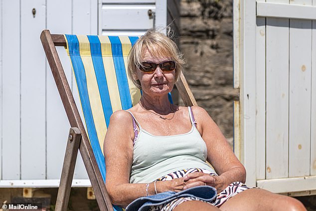 Carol has been having a similarly grim time watching the bikes whizz past, creating muddy track marks in heaps of sand which have not been cleaned up by staff
