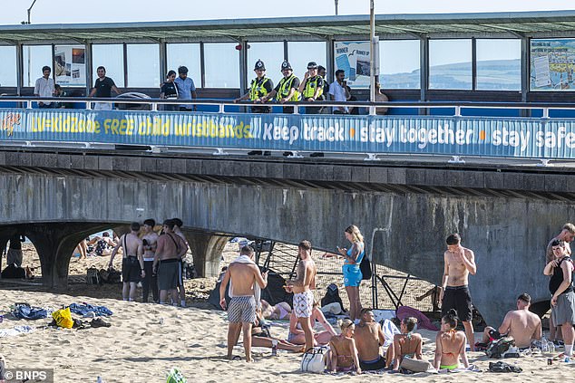 Police looking over the beach from the Pier as they seek to crackdown on people using nitrous oxide in the popular getaway spot