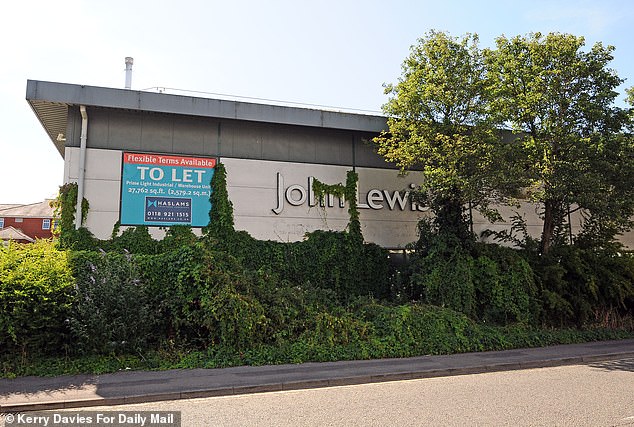 While John Lewis Partnership had initially submitted a planning application for 215 homes at a cost of £80million, these have since been scaled back to 170 dwellings in an eight-storey-high apartment block. Pictured: the John Lewis building set to be developed into flats