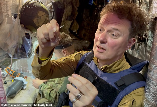 Richard Pendlebury examines a length of the fibre optic cable used in the drones