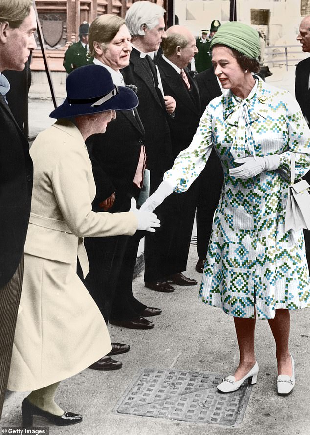 Thatcher, then the Leader of the Opposition, is seen curtseying as she shakes hands with the Queen at the Inter-Parliamentary Conference in Westminster Hall in 1975
