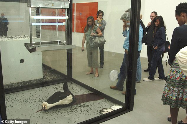 Guests attend the Damien Hirst: 'A Thousand Years and Triptychs' private view at the Gagosian Gallery on June 20, 2006