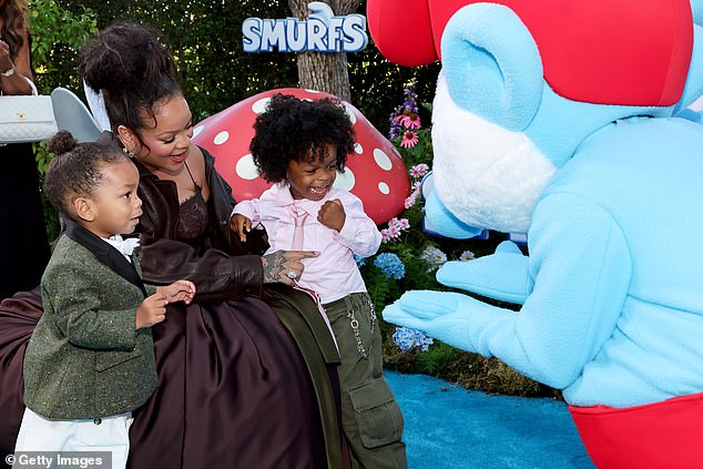 Rihanna - who voiced the character of Smurfette in the upcoming animated film - opted for minimal accessories to allow the dress to be the main focal point, and added a pair of small earrings