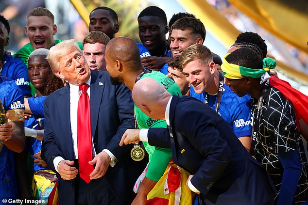 Trump was seen speaking to Chelsea stars, as FIFA president Gianni Infantino attempted unsuccessfully to usher him off the stage