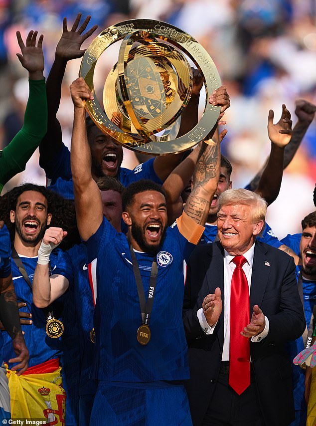 The US President was seen beaming in the background as James lifted the trophy aloft