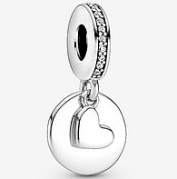 The bracelet also had added to it a heart dangle charm with an engravable disk