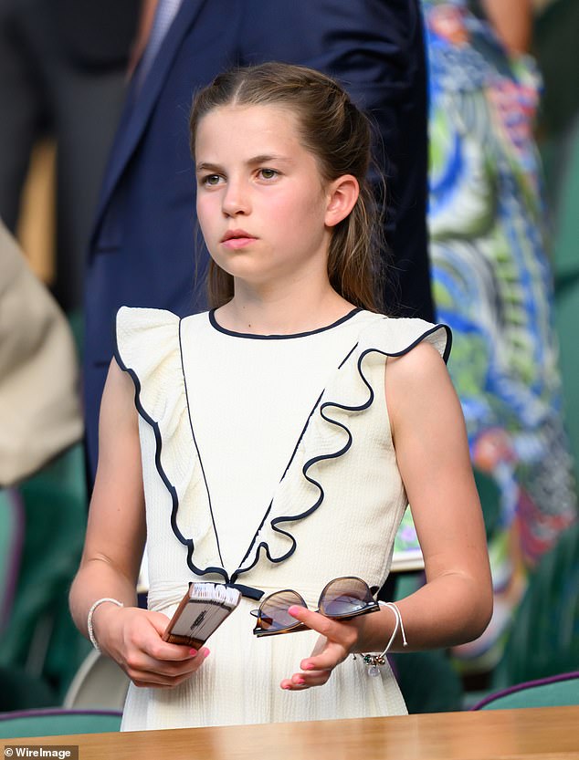 A message appeared to be engraved on one of the charms but even the most eagle-eyed royal fashion fan could not make out what it said