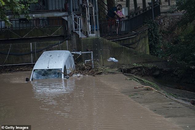 A car remains in the Cardener river due to heavy rains on July 12, 2025