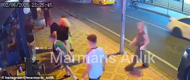 A young boy is also seen squaring up to one of the restaurant employees as he readies himself to fight by punching the air