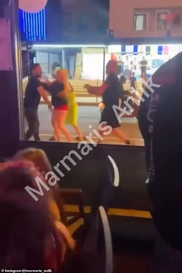 Shocking footage shows the group, including women, being kicked and punched by employees on a street in Marmaris, Turkey