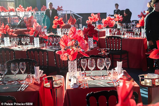 The glamourous interior, dotted with red touches, is pictured before the guests' arrival