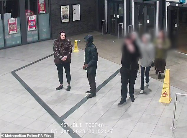 Marten and Gordon walking into Bolton bus interchange with their baby allegedly underneath Marten's coat - the couple were on the run for nearly two months
