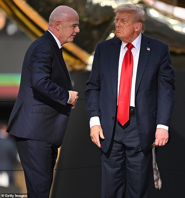 Trump was seen still holding onto the prize later on in the victory ceremony on Sunday