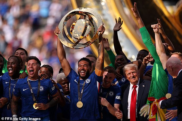 He was then seen alongside Chelsea as they lifted the trophy after winning the competition