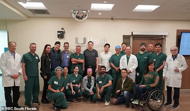 Elon Musk is seen alongside the doctors and scientists at University of Miami Health System