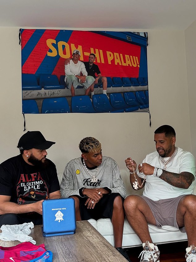 The teenager was also gifted a £300,000 chain baring his initials by Dominican rapper El Alfa