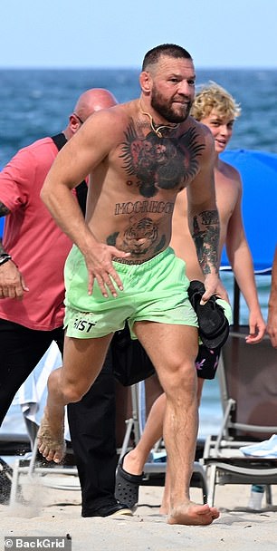 Conor was spotted cooling off following the steamy interaction on the beach