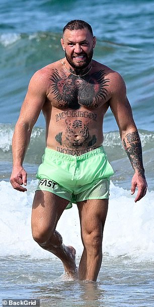 Conor was spotted cooling off following the steamy interaction on the beach