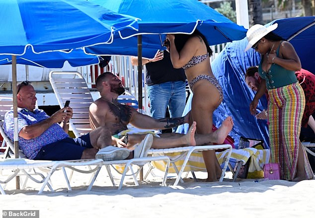 The group kicked back together in the shade