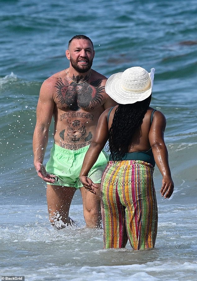 McGregor was joined by the female pal in the water