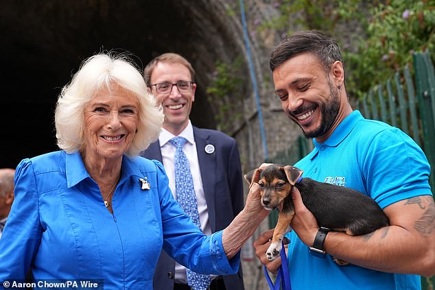 In true animal-lover fashion, Camilla fastened a sweet Yorkshire Terrier badge to her chest to honour her visit to the animal shelter, which cares for strays and abandoned pets